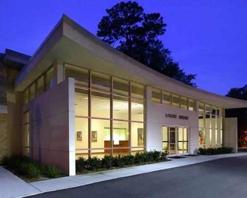 Nighttime exterior photo of the Swisher Theatre